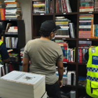 Officers from the Malaysian Ministry of Home Affairs raiding Toko Buku Rakyat in Kuala Lumpur, Malaysia.