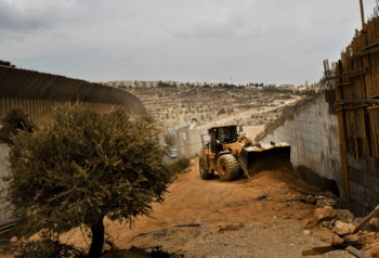 | Israeli machinery tears the ground asunder during the construction of Israels so called separation barrier in the occupied West Bank Bernat Armangue | AP | MR Online