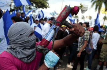 | Anti government protester during 2018 coup attempt in Nicaragua Numbers of the protesters were tied to groups that had received funding from the National Endowment for Democracy NED Source yahoocom | MR Online