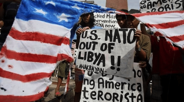| Image from a US protest against USNATOs actions in Libya Image credit Al Mayadeen English | MR Online