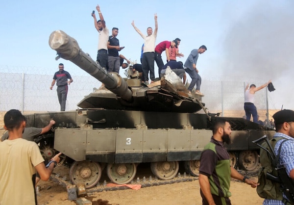 | PALESTINIANS TAKE CONTROL OF AN ISRAELI TANK AFTER CROSSING THE BORDER FENCE WITH ISRAEL FROM KHAN YUNIS IN THE SOUTHERN GAZA STRIP ON OCTOBER 7 2023 PHOTO STRINGER APA IMAGES | MR Online