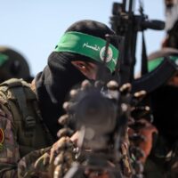 Palestinian fighters with the Qassam Brigades, the military wing of Hamas, pictured in Gaza in July. Majdi Fathi APA images