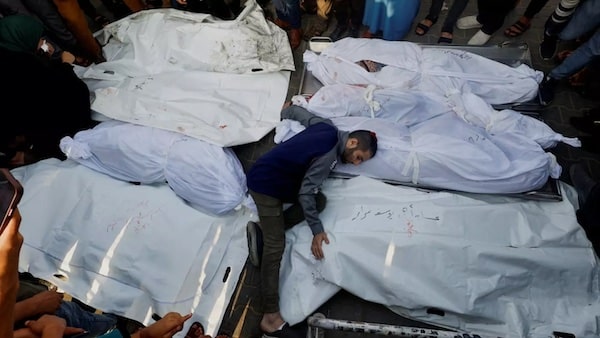 MR Online | A mourner reacts amidst the bodies as people attend funeral for Palestinians killed in Israeli strikes in Khan Younis southern Gaza Strip on 24 October 2023 Reuters | MR Online