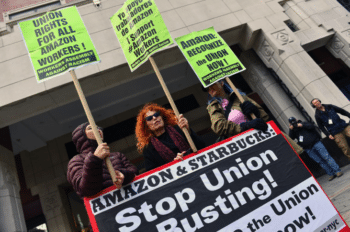 | Workers protest outside Amazon | MR Online's JFK8 warehouse in Staten Island, N.Y., as they vote to establish the first Amazon union in the United States on April 1, 2022. PHOTO BY ANDREA RENAULT/AFP VIA GETTY IMAGES