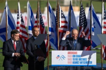 | Schumer right speaks as Republican Mike Johnson left and Democrat Hakeem Jeffries listen at a pro Israel march in DC Nov 14 2023 Mark Schiefelbein | AP | MR Online