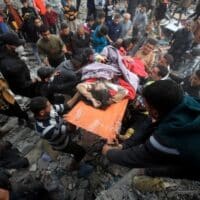 | Palestinians rescue people injured in a deadly Israeli airstrike in Khan Younis southern Gaza on 7 December Mohammed Zaanoun ActiveStills | MR Online