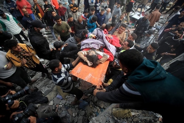 | Palestinians rescue people injured in a deadly Israeli airstrike in Khan Younis southern Gaza on 7 December Mohammed Zaanoun ActiveStills | MR Online