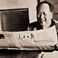 Chairman Mao reading People's Daily in Hangzhou, 1961.