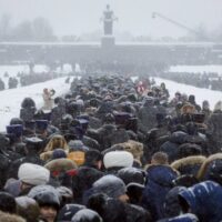 On the 75th anniversary of the battle that lifted the Siege of Leningrad in World War 2, people walk in snowfall to the Motherland monument to place flowers at the Piskaryovskoye Cemetery where the victims were buried, St. Petersburg, Russia, January 26, 2019