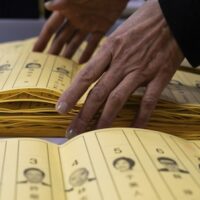 Staff count votes at a polling station in Taipei, Taiwan, January 13, 2024