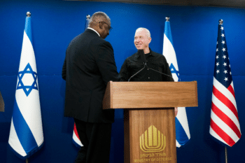 | Israeli Minister of Defense Yoav Gallant right shakes hands with US Secretary of Defense Lloyd Austin after a meeting in Tel Aviv Dec 18 2023 Maya Alleruzzo | AP | MR Online