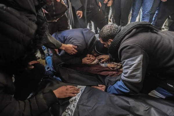 | Palestinians grieve over the bodies of loved ones killed in Israeli bombardment of an encampment for displaced people in al Mawasi an area of Khan Younis in southern Gaza 25 January Mohammed Talatene DPA | MR Online