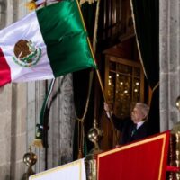 Mexican President Andrés Manuel López Obrador waving the flag of Mexico. Photo from Wikimedia Commons.