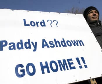 | A Bosnian policeman decertified for failing to meet UN standards holds a banner during a protest in front of the Office of the High Representatives Paddy Ashdown in Sarajevo 2006 Hidajet Delic | AP | MR Online