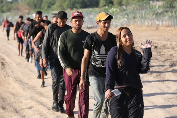 | A group of migrants seeking US asylum walk down a road beside the Rio Grande River to turn themselves in to the Border Patrol | MR Online