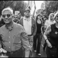 Benedicto Martínez and Robin Alexander march together in Mexico City in a 2014 national protest on the 20th anniversary of the implementation of the North American Free Trade Agreement (NAFTA). (David Bacon)