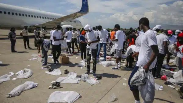 | Haitians deported from the US recover their scattered belongs at Toussaint Louverture International Airport in Port au Prince Haiti in 2021 Joseph OdelynAP | MR Online