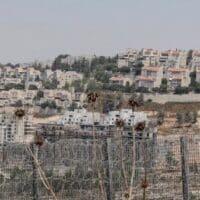 Illegal settlements in the West Bank around the caged Palestinians. (People's Dispatch/Creative Commons license)