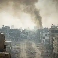 Smoke rises after Israeli airstrikes in Beit Lahia, in the northern Gaza Strip, December 28, 2023. (Yonatan Sindel/Flash90)