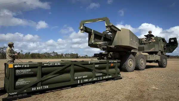 MR Online | A US Army soldier prepares the crane for loading the Army Tactical Missile System ATACMS on to the High Mobility Artillery Rocket System HIMARS in Queensland Australia July 26 2023 AP PhotoSgt 1st Class Andrew Dickson | MR Online