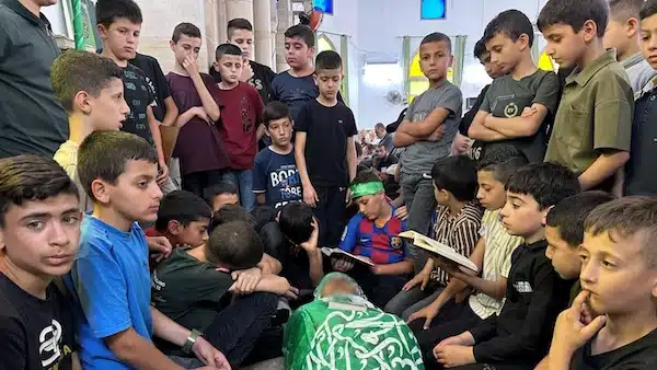 | Students gather around the body of their school teacher Allam Jaradat who was killed by Israeli forces in Jenin in the occupied West Bank 21 May 2024 ReutersAli Sawafta | MR Online