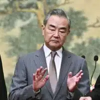 China's Foreign Minister Wang Yi (centre) hosts an event for Mahmoud al-Aloul, left, vice chairman of Fatah, and Mussa Abu Marzuk, a senior member of Hamas, to meet at the Diaoyutai State Guesthouse in Beijing, July 23, 2024