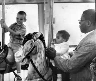 | Charles Langley holds his daughter Sharon the first African American to ride at the Gwynn Oak Park August 28 1963 Image Baltimore Sun | MR Online