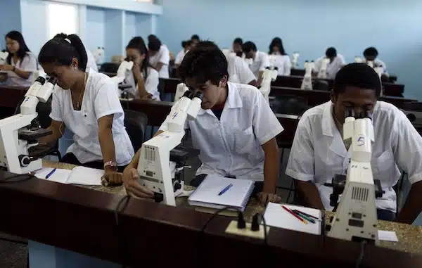 | Medicine students look through microscopes at a laboratory of the Latin American School of Medicine in Havana | Javier Galeano AP | MR Online