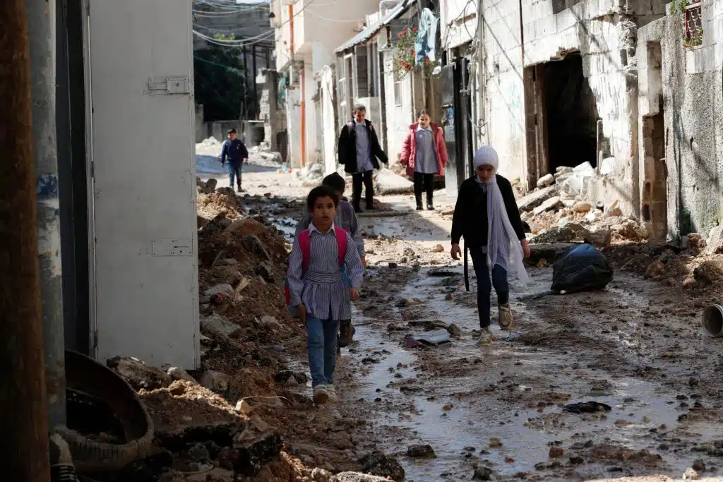 | PALESTINIANS CHILDREN WALK THROUGH THE DAMAGED STREETS OF TULKAREM REFUGEE CAMP FOLLOWING AN ISRAELI RAID MARCH 11 2024 PHOTO © ALAA BADARNEHEFE VIA ZUMA PRESSAPA IMAGES | MR Online