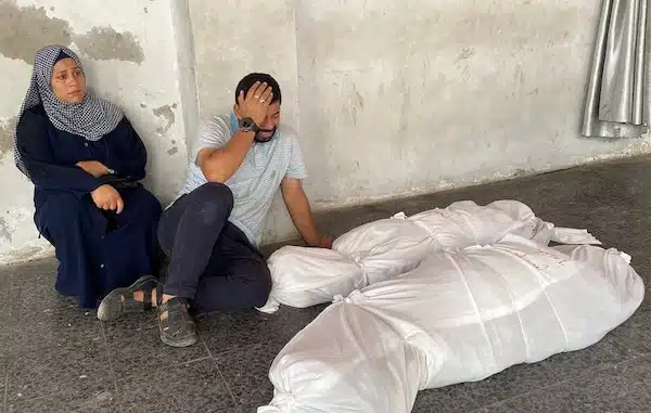 | Palestinians mourn beside the shrouded bodies of loved ones killed during an Israeli airstrike on a house in the Jabaliya refugee camp 21 October Hadi Daoud APA images | MR Online