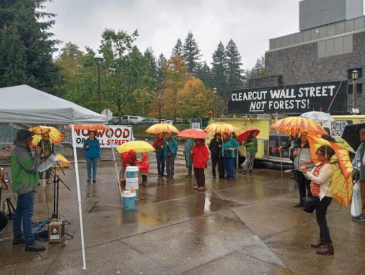 | Brenna Bell speaking outside the forestry industry event in Portland last month WNVNick Engelfried | MR Online