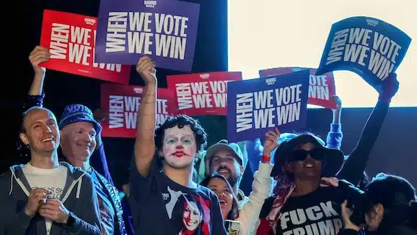 MR Online | Attendees hold up signs during a campaign rally with Democratic presidential nominee and US Vice President Kamala Harris at Craig Ranch Amphitheater Las Vegas Nevada on 31 October 2024 Ethan MillerGetty ImagesAFP | MR Online