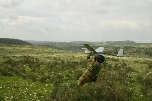 MR Online | An IDF soldier prepares to launch a Skylark drone manufactured by Elbit Systems an Israel based international military technology company and defense contractor Photo courtesy the Israel Defense ForcesFlickr | MR Online