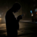 Resident looks at his cell phone during power failure in Havana, Cuba, October 20, 2024. Ramon Espinosa - staff, ASSOCIATED PRESS